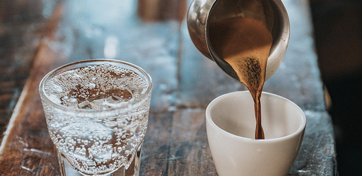 Shot of tonic water and shot of espresso