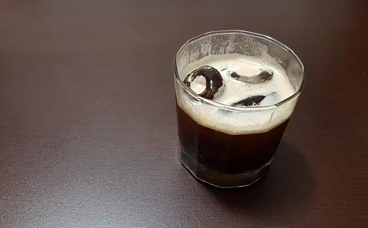 A Carajillo in a clear glass