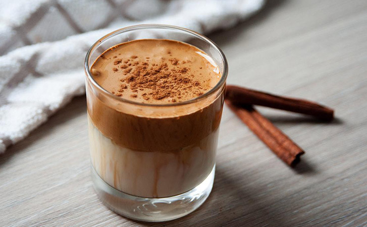 Amaretto coffee with cinnamon sprinkled on top