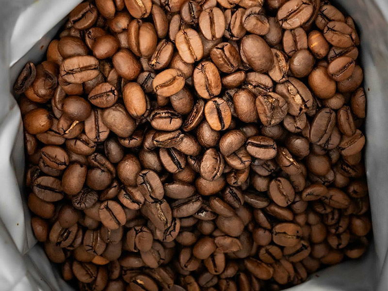 roasted coffee beans in a bag