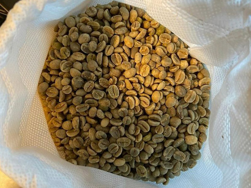 green coffee beans in a bag