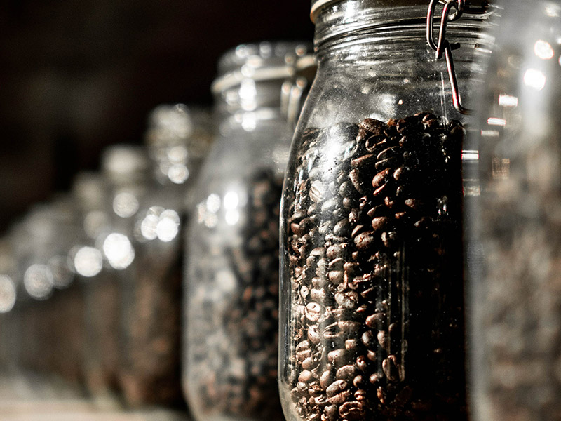 roasted coffee beans in a jar